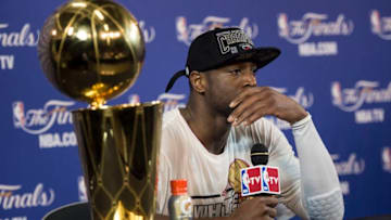 Dwyane Wade of the Miami Heat speaks to reporters after Game 7 of the NBA Finals at the American Airlines Arena June 20, 2013 in Miami, Florida. The Miami Heat beat the San Antonio Spurs 95-88 to win the 2013 NBA Championship. AFP PHOTO/Brendan SMIALOWSKI (Photo credit should read BRENDAN SMIALOWSKI/AFP/Getty Images)