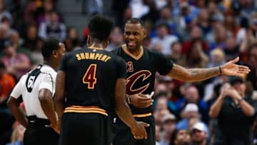 Dec 29, 2015; Denver, CO, USA; Cleveland Cavaliers forward LeBron James (23) and guard Iman Shumpert (4) talk with referee James Williams (60) in the fourth quarter against the Denver Nuggets at the Pepsi Center. The Cavaliers defeated the Nuggets 93-87. Mandatory Credit: Isaiah J. Downing-USA TODAY Sports
