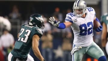 Dec 29, 2013; Arlington, TX, USA; Dallas Cowboys tight end Jason Witten (82) stiff arms after a reception against Philadelphia Eagles safety Patrick Chung (23) at AT&T Stadium. Mandatory Credit: Matthew Emmons-USA TODAY Sports