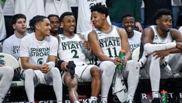 Michigan State's Tyson Walker, left, and A.J. Hoggard, right, share a laugh on the bench during the second half in the game against Indiana on Tuesday, Feb. 21, 2023, at the Breslin Center in East Lansing.230221 Msu Indiana Bball 207a