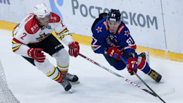 SAINT PETERSBURG, RUSSIA - 2018/01/09: Roman Graborenko (L) of HC Kunlun Red Star and Yegor Rykov of HC SKA Saint Petersburg in action during the 2017/18 Kontinental Hockey League Regular Season match between HC Kunlun Red Star and HC SKA Saint Petersburg at Ice Palace on January 09, 2018 in St. Petersburg, Russia. (Photo by Igor Russak/SOPA Images/LightRocket via Getty Images)