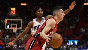 Miami Heat guard Tyler Herro (14) drives past Philadelphia 76ers guard Tyrese Maxey (0)(Jim Rassol-USA TODAY Sports)