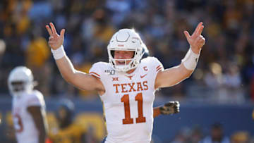 MORGANTOWN, WV - OCTOBER 05: Sam Ehlinger #11 of the Texas Longhorns reacts after rushing for a touchdown against the West Virginia Mountaineers during a game at Mountaineer Field on October 5, 2019 in Morgantown, West Virginia. Texas defeated West Virginia 42-31. (Photo by Joe Robbins/Getty Images)