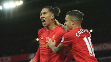Liverpool's Brazilian midfielder Roberto Firmino (L) celebrates scoring his team's fourth goal with Liverpool's Brazilian midfielder Philippe Coutinho during the English Premier League football match between Liverpool and Watford at Anfield in Liverpool, north west England on November 6, 2016. / AFP / PAUL ELLIS / RESTRICTED TO EDITORIAL USE. No use with unauthorized audio, video, data, fixture lists, club/league logos or 'live' services. Online in-match use limited to 75 images, no video emulation. No use in betting, games or single club/league/player publications. / (Photo credit should read PAUL ELLIS/AFP/Getty Images)