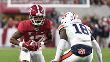 Auburn footballNov 26, 2022; Tuscaloosa, Alabama, USA; Alabama Crimson Tide wide receiver Isaiah Bond (17) runs the ball against Auburn Tigers cornerback Nehemiah Pritchett (18) at Bryant-Denny Stadium. Alabama won 49-27. Mandatory Credit: Gary Cosby Jr.-USA TODAY Sports