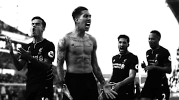 STOKE ON TRENT, ENGLAND - APRIL 08: (EDITOR'S NOTE: THIS IMAGE HAS BEEN CONVERTED TO BLACK AND WHITE) Roberto Firmino of Liverpool celebrates scoring his side's second goal during the Premier League match between Stoke City and Liverpool at Bet365 Stadium on April 8, 2017 in Stoke on Trent, England. (Photo by Chris Brunskill Ltd/Getty Images)