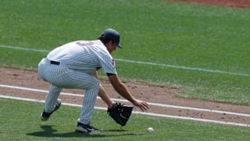 Jun 21, 2021; Omaha, Nebraska, USA; Arizona Wildcats pitcher Quinn Flanagan (40) fields the ball against the Stanford Cardinal at TD Ameritrade Park. Mandatory Credit: Bruce Thorson-USA TODAY Sports