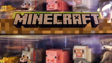 Characters from game Minecraft, produced by Mojang AB, sit displayed for sale during the EGX gaming conference at Earls Court in London, U.K., on Thursday, Sept. 25, 2014. Sony Corp. will begin selling its PlayStation TV set-top box in the U.S. and Europe next month with almost 700 games available, including select Angry Birds, Borderlands, Lego and FIFA soccer titles. Photographer: Chris Ratcliffe/Bloomberg via Getty Images