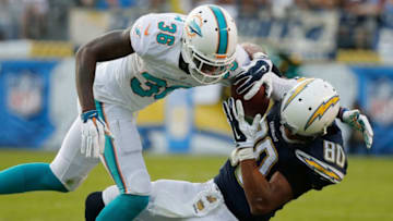 SAN DIEGO, CA - DECEMBER 20: Malcom Floyd #80 of the San Diego Chargers catches a pass as defensive back Tony Lippett #36 of the Miami Dolphins defends during the second half of a game at Qualcomm Stadium on December 20, 2015 in San Diego, California. (Photo by Sean M. Haffey/Getty Images)