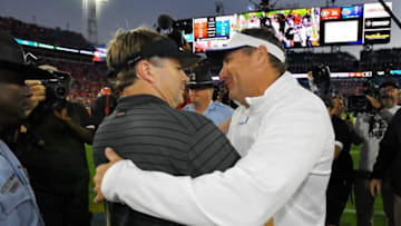 Georgia Bulldogs head coach Kirby Smart and Florida Gators head coach Dan Mullen greet each other mid field after the Gator's loss to the bulldogs Saturday night in Jacksonville. The Florida Gators fell to the Georgia Bulldogs 34 to 7. The Florida Gators were the home team for this years annual Florida vs Georgia college football rivalry game at TIAA Bank field in Jacksonville, Florida Saturday, October 30, 2021. [Bob Self/Florida Times-Union]Jki 103021 Bsfloridageorgia 24
