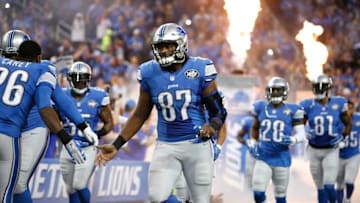 Dec 3, 2015; Detroit, MI, USA; Detroit Lions tight end Brandon Pettigrew (87) gives five to strong safety Don Carey (26) before the game against the Green Bay Packers at Ford Field. Packers win 27-23. Mandatory Credit: Raj Mehta-USA TODAY Sports