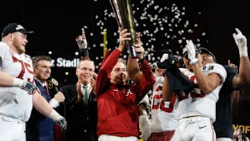 ATLANTA, GA - JANUARY 08: Head coach Nick Saban of the Alabama Crimson Tide holds the trophy while celebrating with his team after defeating the Georgia Bulldogs in overtime to win the CFP National Championship presented by AT&T at Mercedes-Benz Stadium on January 8, 2018 in Atlanta, Georgia. (Photo by Jamie Squire/Getty Images)