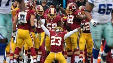 Dec 22, 2013; Landover, MD, USA; Washington Redskins cornerback DeAngelo Hall (23) celebrates after an interception against the Dallas Cowboys in the third quarter at FedEx Field. The Cowboys won 24-23. Mandatory Credit: Geoff Burke-USA TODAY Sports