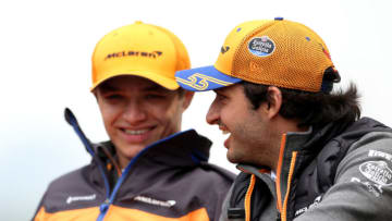SHANGHAI, CHINA - APRIL 14: Lando Norris of Great Britain and McLaren F1 talks with Carlos Sainz of Spain and McLaren F1 before the F1 Grand Prix of China at Shanghai International Circuit on April 14, 2019 in Shanghai, China. (Photo by Charles Coates/Getty Images)
