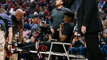 Feb 5, 2016; Denver, CO, USA; Chicago Bulls guard Jimmy Butler (21) is loaded onto a cart after a play in the second quarter against the Denver Nuggets at the Pepsi Center. Mandatory Credit: Isaiah J. Downing-USA TODAY Sports