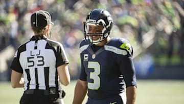 Sep 25, 2016; Seattle, WA, USA; Seattle Seahawks quarterback Russell Wilson (3) talks to line judge Sarah Thomas (53) during a time out in a game against the San Francisco 49ers at CenturyLink Field. Mandatory Credit: Troy Wayrynen-USA TODAY Sports