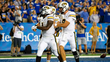 Sep 11, 2021; Lexington, Kentucky, USA; Missouri Tigers quarterback Connor Bazelak (8) and offensive lineman Michael Maietti (55) celebrate a touchdown by running back Tyler Badie (1) during the fourth quarter against the Kentucky Wildcats at Kroger Field. Mandatory Credit: Jordan Prather-USA TODAY Sports