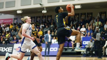 Dec 1, 2022; Montverde, Florida, USA; Montverde guard Chris Johnson (1) is chased by IMG Academy guard Blue Cain in the second quarter during the Sunshine Classic basketball tournament at Mills Championship Court on the campus of Montverde Academy. Mandatory Credit: Reinhold Matay-USA TODAY Sports