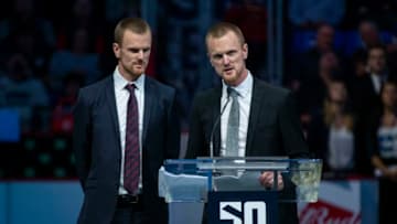 VANCOUVER, BC - FEBRUARY 20: Henrik Sedin speaks to the crowd near Daniel Sedin during a ceremony celebrating their careers as Vancouver Canucks on February 12, 2020 in Vancouver, Canada. (Photo by Ben Nelms/Getty Images)