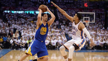 May 24, 2016; Oklahoma City, OK, USA; Golden State Warriors guard Klay Thompson (11) handles the ball against Oklahoma City Thunder guard Andre Roberson (21) during the third quarter in game four of the Western conference finals of the NBA Playoffs at Chesapeake Energy Arena. Mandatory Credit: Mark D. Smith-USA TODAY Sports