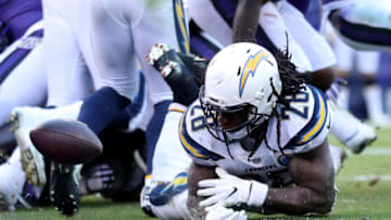 BALTIMORE, MARYLAND - JANUARY 06: Melvin Gordon #28 of the Los Angeles Chargers loses the ball on the 1 yard line against the Baltimore Ravens during the fourth quarter in the AFC Wild Card Playoff game at M&T Bank Stadium on January 06, 2019 in Baltimore, Maryland. (Photo by Patrick Smith/Getty Images)