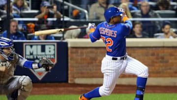 Oct 12, 2015; New York City, NY, USA; New York Mets center fielder Yoenis Cespedes (52) hits a three run home run during the fourth inning against the Los Angeles Dodgers in game three of the NLDS at Citi Field. Mandatory Credit: Anthony Gruppuso-USA TODAY Sports