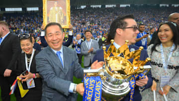 LEICESTER, ENGLAND - MAY 07: Leceister City owner Vichai Srivaddhanaprabha (L) and son Aiyawatt Srivaddhanaprabha hold the Premier League Trophy after the Barclays Premier League match between Leicester City and Everton at The King Power Stadium on May 7, 2016 in Leicester, United Kingdom. (Photo by Michael Regan/Getty Images)