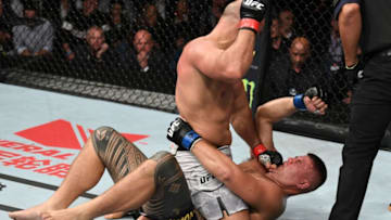 ADELAIDE, AUSTRALIA - DECEMBER 02: (L-R) Junior Dos Santos of Brazil punches Tai Tuivasa of Australia in their heavyweight bout during the UFC Fight Night event inside Adelaide Entertainment Centre on December 2, 2018 in Adelaide, Australia. (Photo by Jeff Bottari/Zuffa LLC/Zuffa LLC via Getty Images)