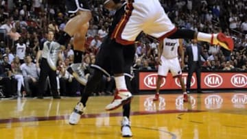 Apr 8, 2014; Miami, FL, USA; Brooklyn Nets forward Mason Plumlee (1) blocks the shot from Miami Heat forward LeBron James (6) during the second half at American Airlines Arena. The Nets won 88-87. Mandatory Credit: Steve Mitchell-USA TODAY Sports