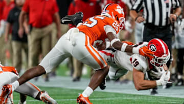 Sep 4, 2021; Charlotte, North Carolina, USA; Georgia Bulldogs tight end Brock Bowers (19) dives with the catch covered by Clemson Tigers safety Jalyn Phillips (25) during the first quarter at Bank of America Stadium. Mandatory Credit: Jim Dedmon-USA TODAY Sports