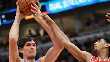 CHICAGO, IL - MARCH 13: Boban Marjanovic #51 of the LA Clippers is fouled by Cameron Payne #22 of the Chicago Bulls at the United Center on March 13, 2018 in Chicago, Illinois. NOTE TO USER: User expressly acknowledges and agrees that, by downloading and or using this photograph, User is consenting to the terms and conditions of the Getty Images License Agreement. (Photo by Jonathan Daniel/Getty Images)
