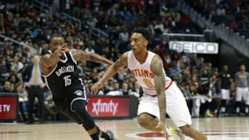 Jan 16, 2016; Atlanta, GA, USA; Atlanta Hawks guard Jeff Teague (0) drives against Brooklyn Nets guard Donald Sloan (15) in the third quarter at Philips Arena. The Hawks won 114-86. Mandatory Credit: Jason Getz-USA TODAY Sports