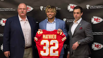 Kansas City Chiefs head coach Andy Reid, left, and general manager Brett Veach, right, introduce safety Tyrann Mathieu in the Stram Theater in Kansas City, Mo., on March 14, 2019. The Chiefs signed Mathieu to a three-year deal reportedly worth $42 million. (Tammy Ljungblad/Kansas City Star/TNS via Getty Images)