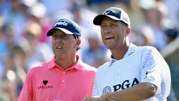 SPRINGFIELD, NJ - JULY 28: Phil Mickelson of the United States talks with caddie Jim 'Bones' Mackay on the 13th tee during the first round of the 2016 PGA Championship at Baltusrol Golf Club on July 28, 2016 in Springfield, New Jersey. (Photo by Stuart Franklin/Getty Images)