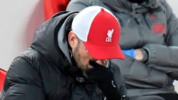 Liverpool's German manager Jurgen Klopp reacts during the English Premier League football match between Liverpool and Burnley at Anfield in Liverpool, north west England on January 21, 2021. (Photo by PETER POWELL / POOL / AFP) / RESTRICTED TO EDITORIAL USE. No use with unauthorized audio, video, data, fixture lists, club/league logos or 'live' services. Online in-match use limited to 120 images. An additional 40 images may be used in extra time. No video emulation. Social media in-match use limited to 120 images. An additional 40 images may be used in extra time. No use in betting publications, games or single club/league/player publications. / (Photo by PETER POWELL/POOL/AFP via Getty Images)