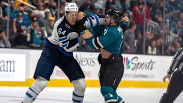 San Jose Sharks, Jacob Middleton (21); Winnipeg Jets, Logan Stanley (64). Mandatory Credit: Neville E. Guard-USA TODAY Sports