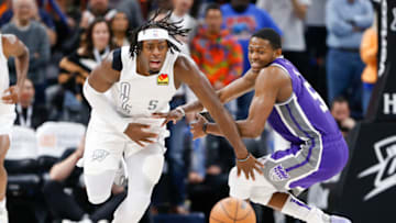 OKC Thunder forward Luguentz Dort (5) runs after a loose ball ahead of Sacramento Kings guard De'Aaron Fox (5) : Alonzo Adams-USA TODAY Sports