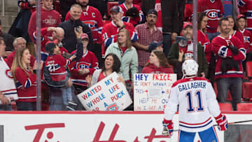 DETROIT, MI - APRIL 05: A fan catches a puck given by Brendan Gallagher