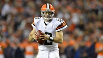 Dec 23 2012; Denver, CO, USA; Cleveland Browns quarterback Colt McCoy (12) attempts a two point conversion on a run in the third quarter against the Denver Broncos at Sports Authority Field. The Broncos defeated the Browns 34-12. Mandatory Credit: Ron Chenoy-USA TODAY Sports