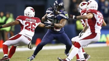 Nov 15, 2015; Seattle, WA, USA; Seattle Seahawks running back Marshawn Lynch (24) rushes against the Arizona Cardinals during the third quarter at CenturyLink Field. Mandatory Credit: Joe Nicholson-USA TODAY Sports