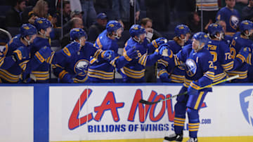 Feb 17, 2022; Buffalo, New York, USA; Buffalo Sabres right wing Kyle Okposo (21) celebrates his goal during the first period against the Ottawa Senators at KeyBank Center. Mandatory Credit: Timothy T. Ludwig-USA TODAY Sports