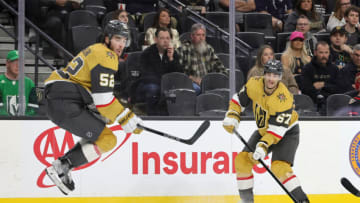 LAS VEGAS, NEVADA - MARCH 06: Dylan Coghlan #52 of the Vegas Golden Knights jumps out of the way of a shot by teammate Max Pacioretty #67 against the Ottawa Senators in the second period of their game at T-Mobile Arena on March 06, 2022 in Las Vegas, Nevada. (Photo by Ethan Miller/Getty Images)