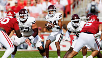FAYETTEVILLE, ARKANSAS - OCTOBER 21: Mike Wright #14 of the Mississippi State Bulldogs takes the snap during the game against the Arkansas Razorbacks at Donald W. Reynolds Razorback Stadium on October 21, 2023 in Fayetteville, Arkansas. The Bulldogs defeated the Razorbacks 7-3. (Photo by Wesley Hitt/Getty Images)