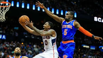 Feb 22, 2014; Atlanta, GA, USA; Atlanta Hawks point guard Jeff Teague (0) shoots a basket past New York Knicks shooting guard Tim Hardaway Jr. (5) in the second half at Philips Arena. The Hawks won 107-98. Mandatory Credit: Daniel Shirey-USA TODAY Sports