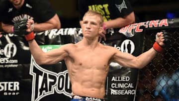 August 30, 2014; Sacramento, CA, USA; T.J. Dillashaw (red gloves) reacts before his fight against Joe Soto (not pictured) during the bantamweight title bout of UFC 177 at Sleep Train Arena. Mandatory Credit: Kyle Terada-USA TODAY Sports