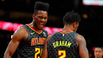 ATLANTA, GA - FEBRUARY 29: Bruno Fernando #24 of the Atlanta Hawks reacts with Treveon Graham #2 during the second half of an NBA game against the Portland Trail Blazers at State Farm Arena on February 29, 2020 in Atlanta, Georgia. NOTE TO USER: User expressly acknowledges and agrees that, by downloading and/or using this photograph, user is consenting to the terms and conditions of the Getty Images License Agreement. (Photo by Todd Kirkland/Getty Images)