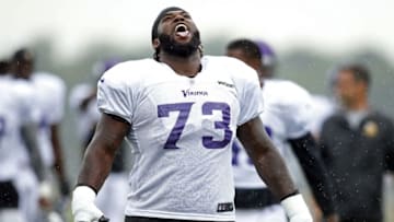 Aug 1, 2016; Mankato, MN, USA; Minnesota Vikings defensive tackle Sharrif Floyd (73) tries to catch rain drops in his mouth during a break from training camp due to a weather delay at Minnesota State University. Mandatory Credit: Bruce Kluckhohn-USA TODAY Sports
