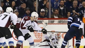 Mar 12, 2016; Winnipeg, Manitoba, CAN; Winnipeg Jets right wing Drew Stafford (12) scores on Colorado Avalanche goalie Semyon Varlamov (1) during the third period at MTS Centre. Winnipeg wins 3-2. Mandatory Credit: Bruce Fedyck-USA TODAY Sports