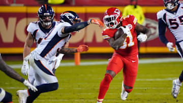 Dec 6, 2020; Kansas City, Missouri, USA; Kansas City Chiefs running back Darrel Williams (31) runs the ball while defended by Denver Broncos free safety Justin Simmons (31) during the second half at Arrowhead Stadium. Mandatory Credit: Jay Biggerstaff-USA TODAY Sports