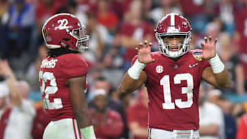 MIAMI, FL - DECEMBER 29: Tua Tagovailoa #13 in action with Najee Harris #22 of the Alabama Crimson Tide during the game against the Oklahoma Sooners at Hard Rock Stadium on December 29, 2018 in Miami, Florida. (Photo by Mark Brown/Getty Images)
